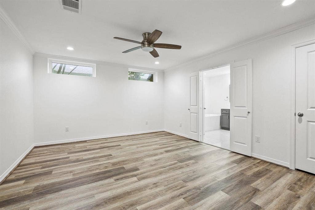 7668 La Cosa Drive, Dallas, TX 75248 Primary Bedroom with ensuite-bath, 2 closets and patio door.