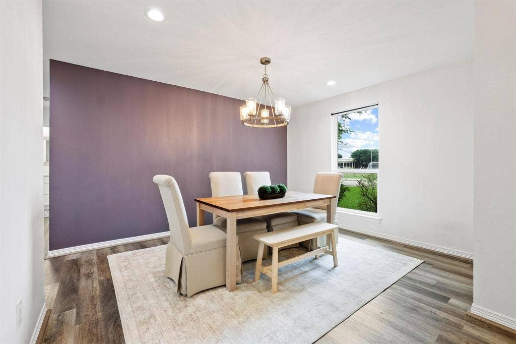 7668 La Cosa Drive, Dallas, TX 75248 Contemporary chandelier, wood-finish flooring, accent wall, white trim
