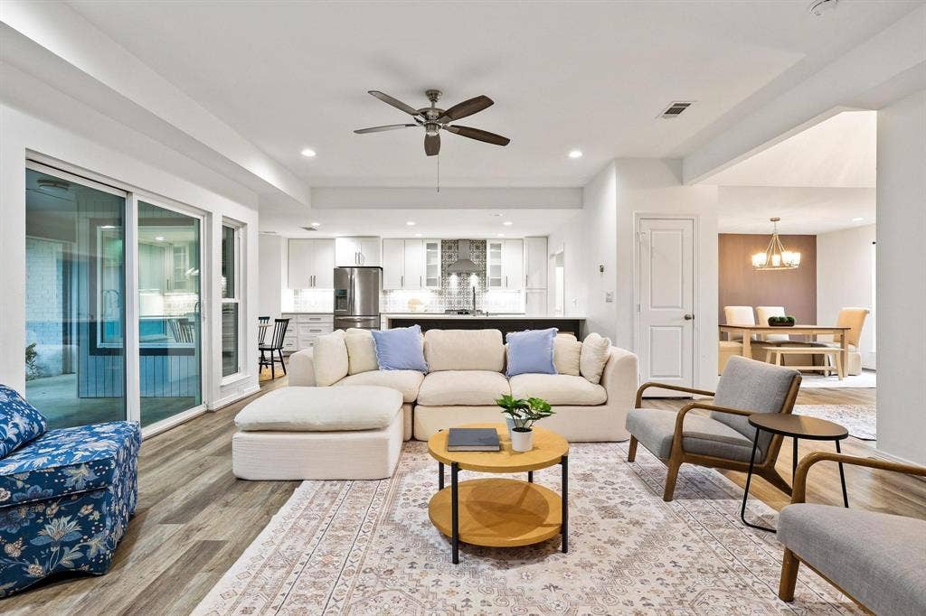 7668 La Cosa Drive, Dallas, TX 75248 Wood-finish flooring, recessed lighting, and a ceiling fan