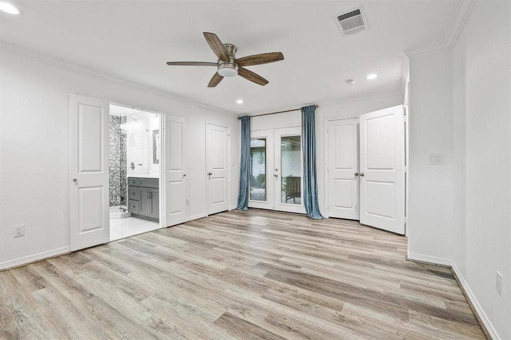 7668 La Cosa Drive, Dallas, TX 75248 Wood-finish flooring throughout, ceiling fan, recessed lighting, and French doors