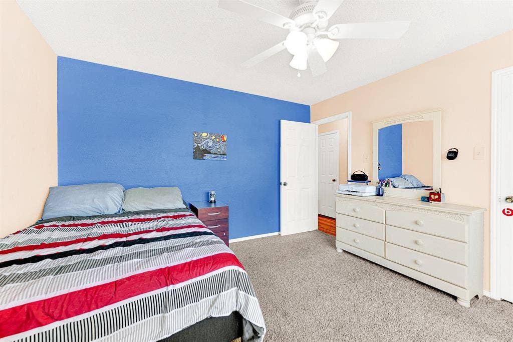 A versatile floor plan offers ample wall space and carpeted floors, giving you complete flexibility for full bedroom suites or a home office setup. It is easy to picture overnight guests settling in comfortably with plenty of room to unpack and feel right at home.
