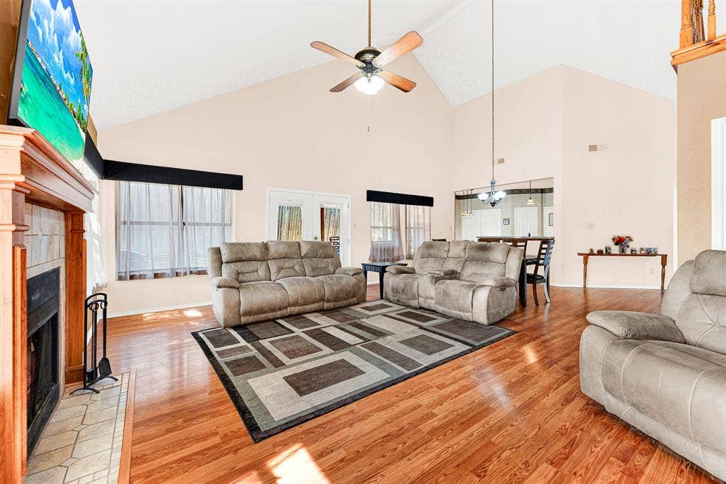 A high-peaked vaulted ceiling amplifies the airy volume of the layout, creating an effortlessly open indoor environment. Imagine gathering loved ones for casual weekend celebrations where conversations flow seamlessly between spaces.
