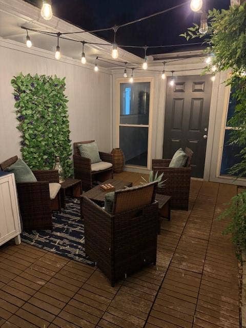 1813 University Drive, Richardson, TX 75081 Deck at night with a patio area and an outdoor hangout area