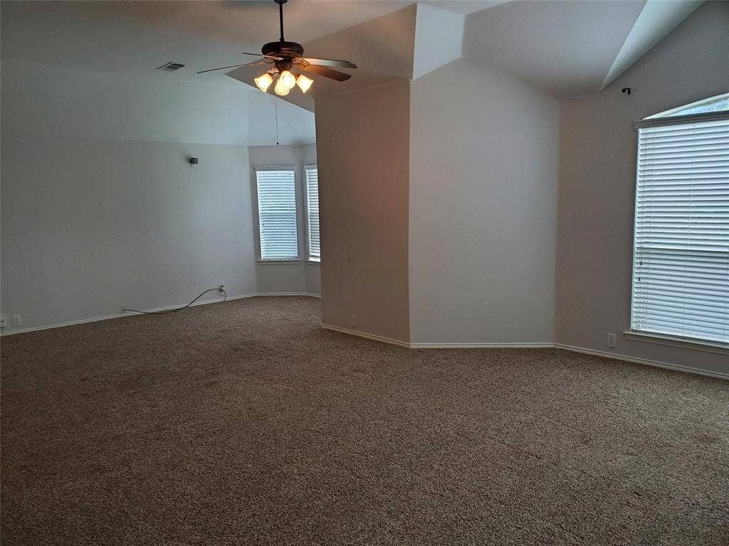 2077 Sleepy Hollow Trail, Frisco, TX 75033 Unfurnished room featuring ceiling fan, vaulted ceiling, and carpet floors
