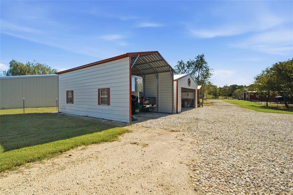 Carport holds dually & LQ trailer or RV