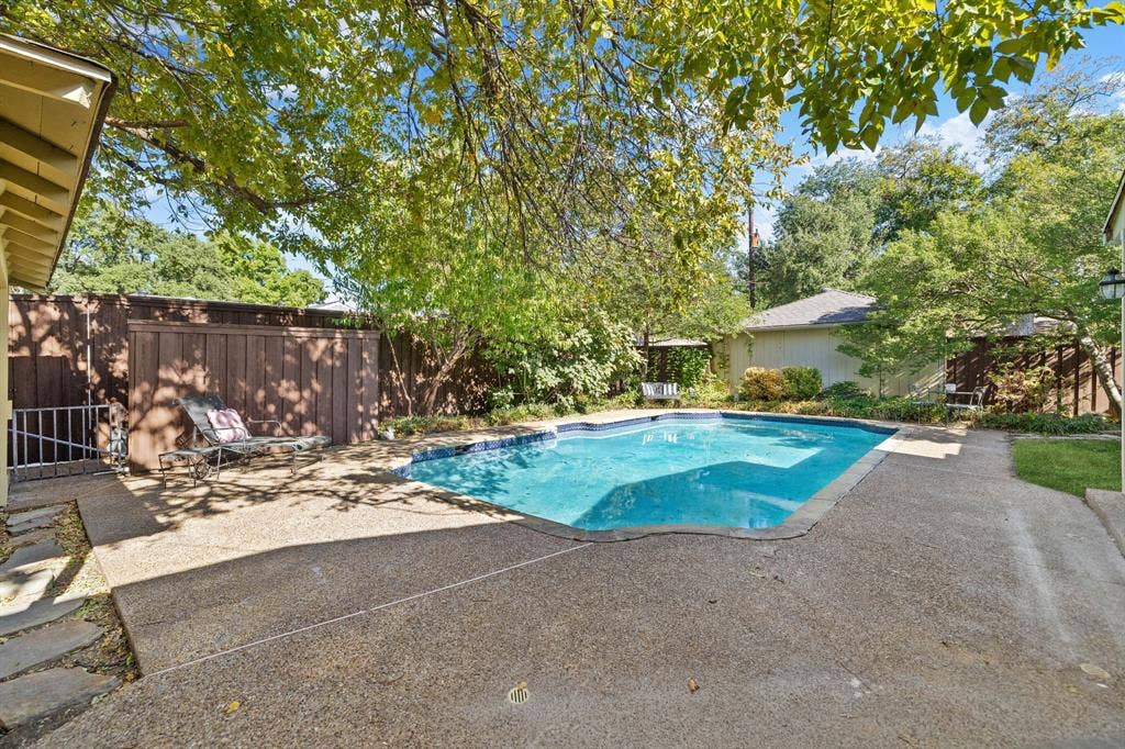 824 Westwood Drive, Richardson, TX 75080 What a great backyard! Tons of desk space for loungers, chairs, etc plus a big pool all in a picturesque yard.