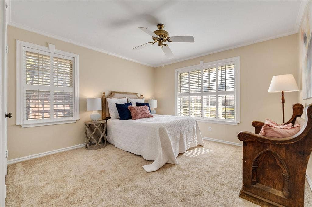 824 Westwood Drive, Richardson, TX 75080 This is one of two secondary bedrooms. This one is quite spacious with a long closet and large windows with trim and plantation shutters. The walls are freshly painted and the carpet is brand new. The seller also mentioned that there are wood floors underneath the carpet as well.