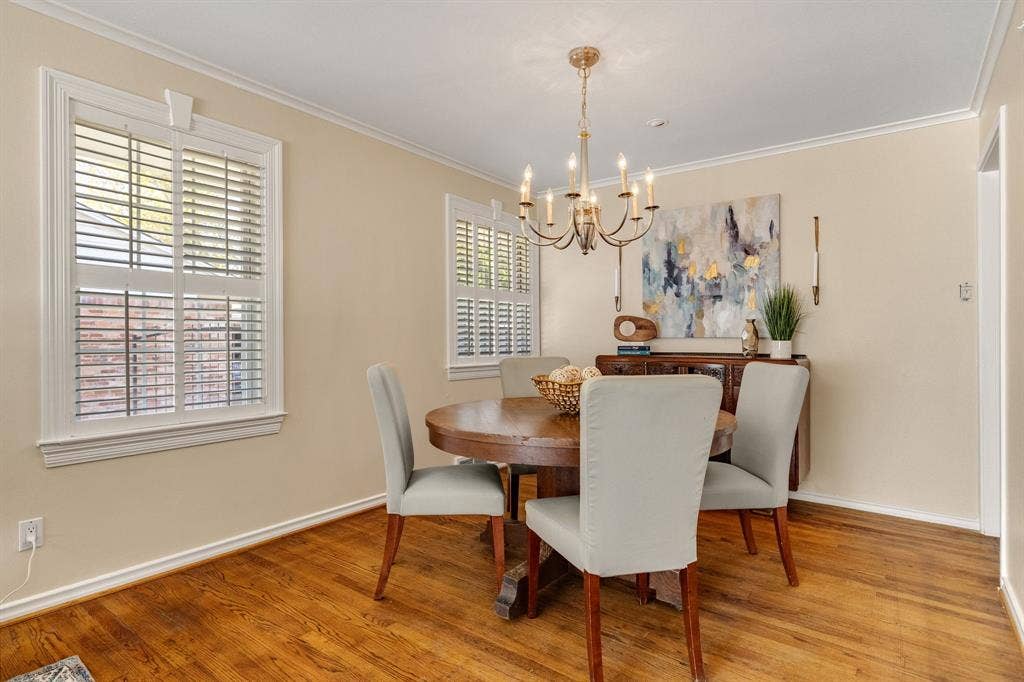 824 Westwood Drive, Richardson, TX 75080 A lovely formal dining room with a classic chandelier and beautiful window trim and plantation shutters. The dining area could easily accommodate a longer rectangular table as well.
