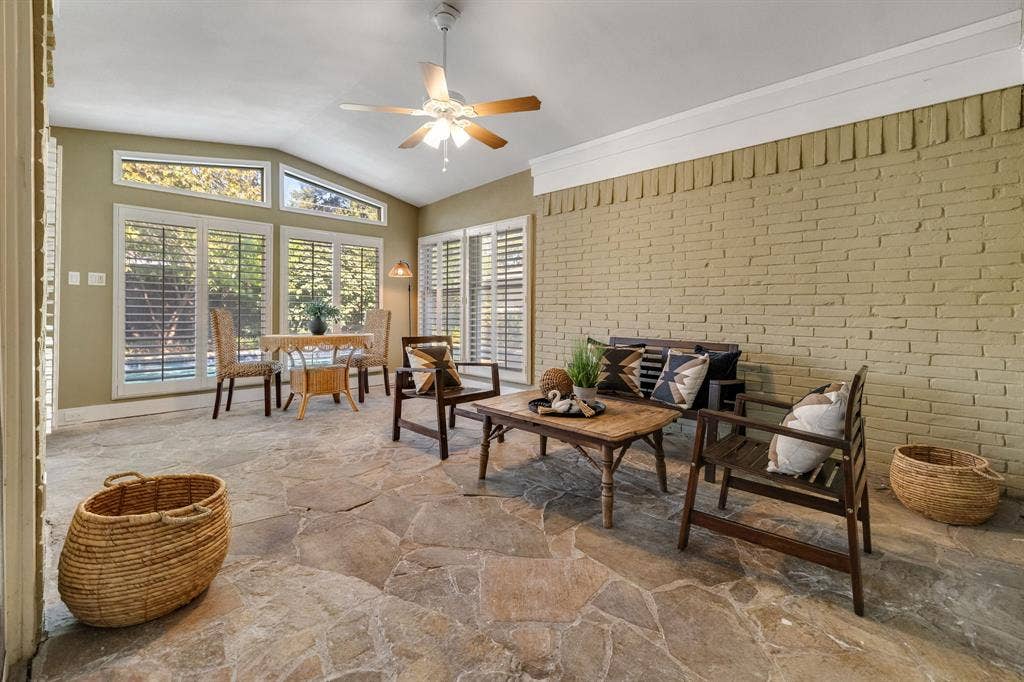 824 Westwood Drive, Richardson, TX 75080 The sunroom is such a lovely room! It has been permitted and added to the tax rolls, is air conditioned/heated with a central HVAC vent, has lighting, a ceiling fan, plugs, plantation shutters and a stone floor.