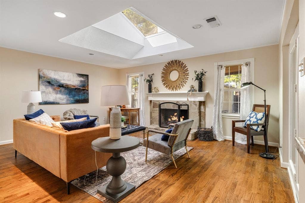 824 Westwood Drive, Richardson, TX 75080 What a great space! The wood floors continue through the family room that is complete with a large sky light and beautiful stone fireplace.
