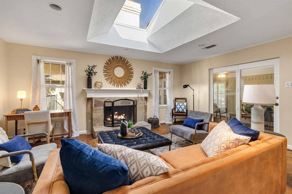 824 Westwood Drive, Richardson, TX 75080 Such a beautiful room. Also, catch a glance of the air conditioned sun room just off the family room.
