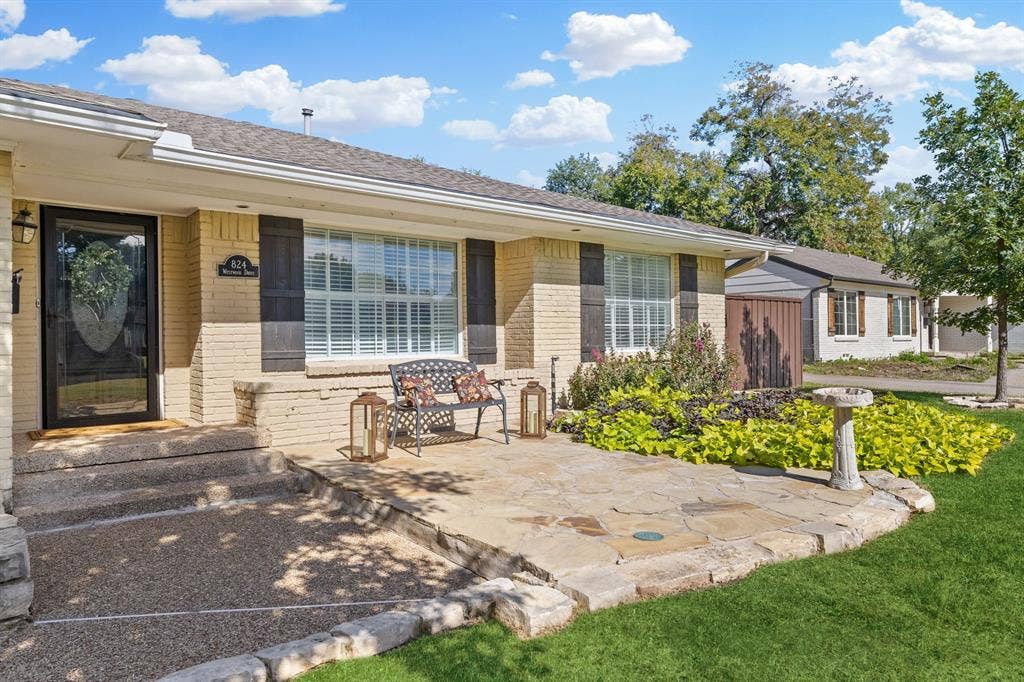 824 Westwood Drive, Richardson, TX 75080 Lovely flagstone patio makes a great spot to relax and say hi to all the neighbors. Painted brick, decorative shutters and upgraded windows add to the curb appeal.