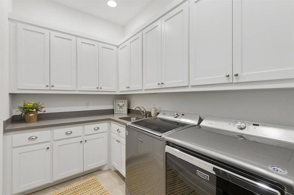 Downstairs Laundry Room, with exceptional storage space.