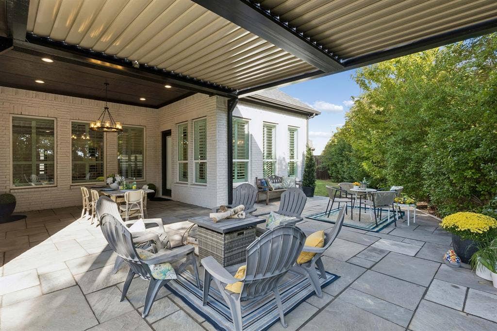 Electric Louver covered patio, Dining al fresco, Firepit, and a corner lot- plenty of room to add that sparkling pool.