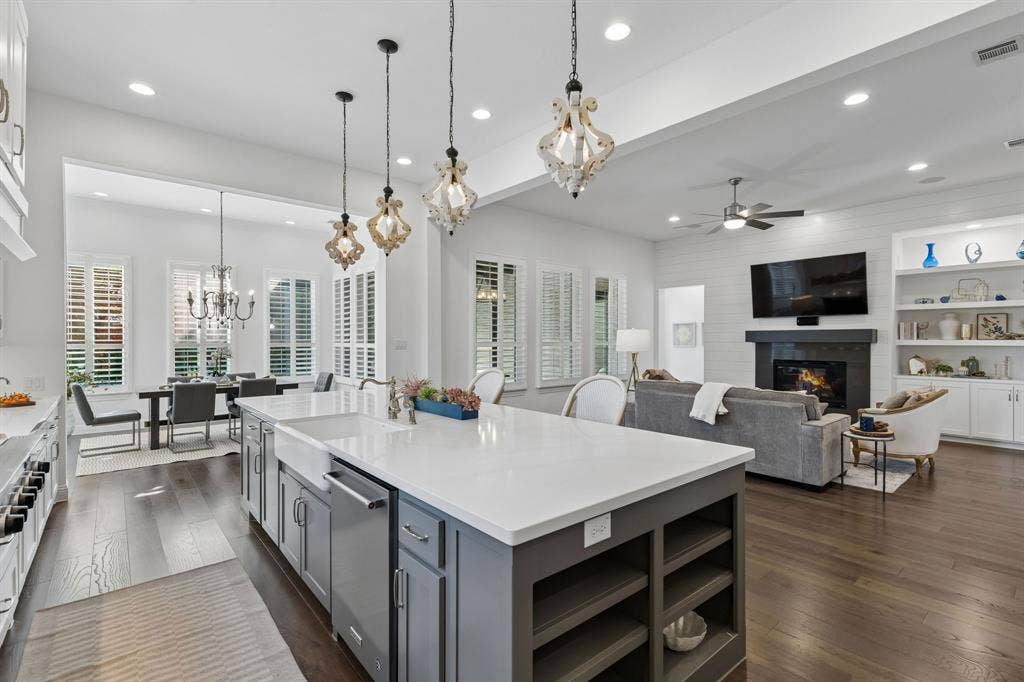 Kitchen open to Family Room, plantation shutters throughout