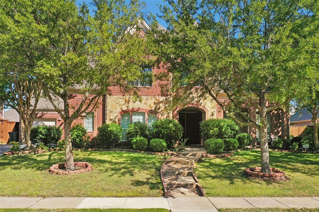 Brick and stone exterior with arched entry