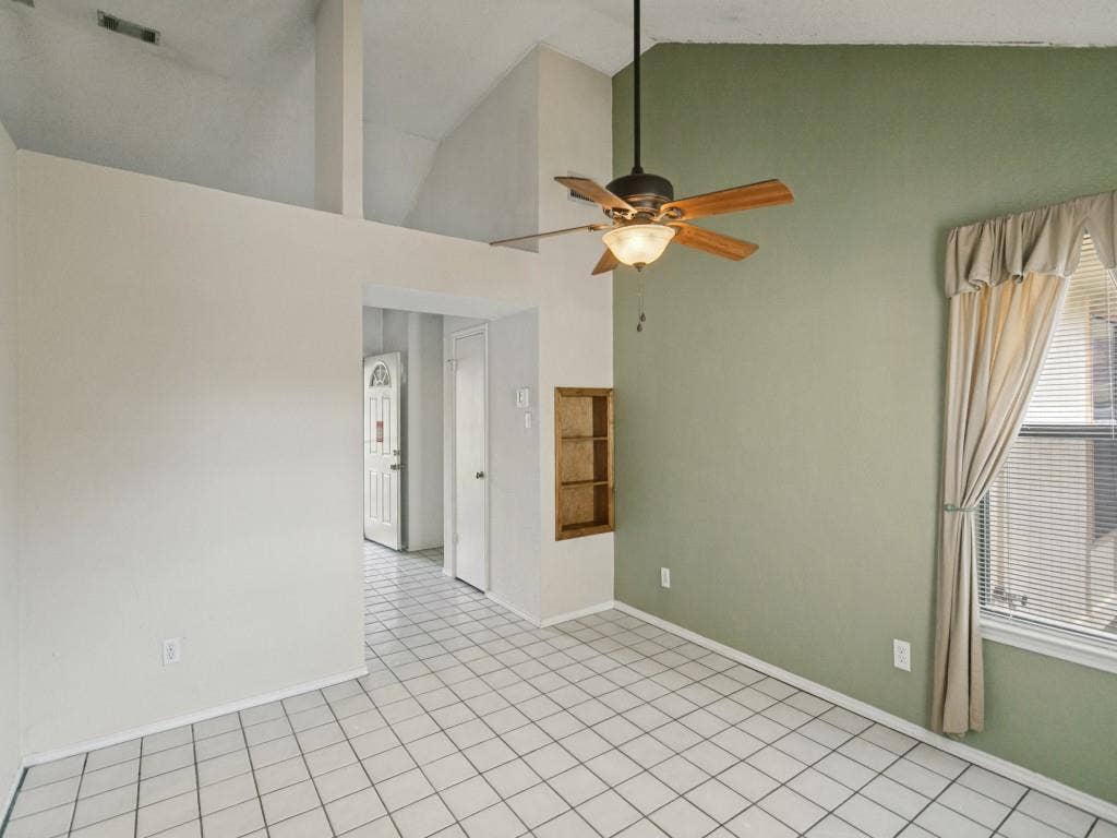 714 Bluebonnet Drive, Allen, TX 75002 Vaulted ceilings, ceramic tile flooring, built-in wall shelving, and a ceiling fan with integrated lighting