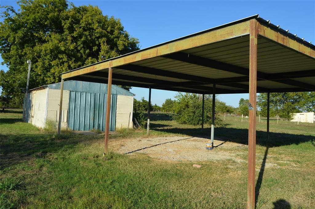 3345 County Road 1125, Farmersville, TX 75442 Rear view of garage/shop and carport
