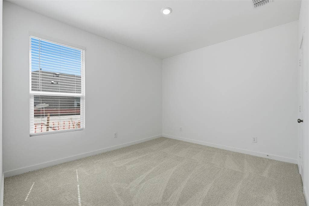 7117 Black Cherry Lane, McKinney, TX 75071 Carpeted flooring, single window with horizontal blinds, recessed ceiling light, white painted walls