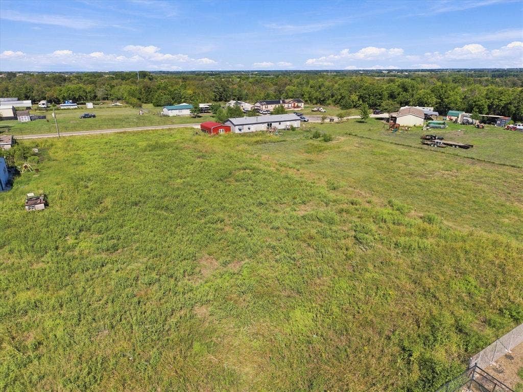 276 Winding River Circle, Farmersville, TX 75442 Expansive undeveloped land featuring natural vegetation and a distant tree line