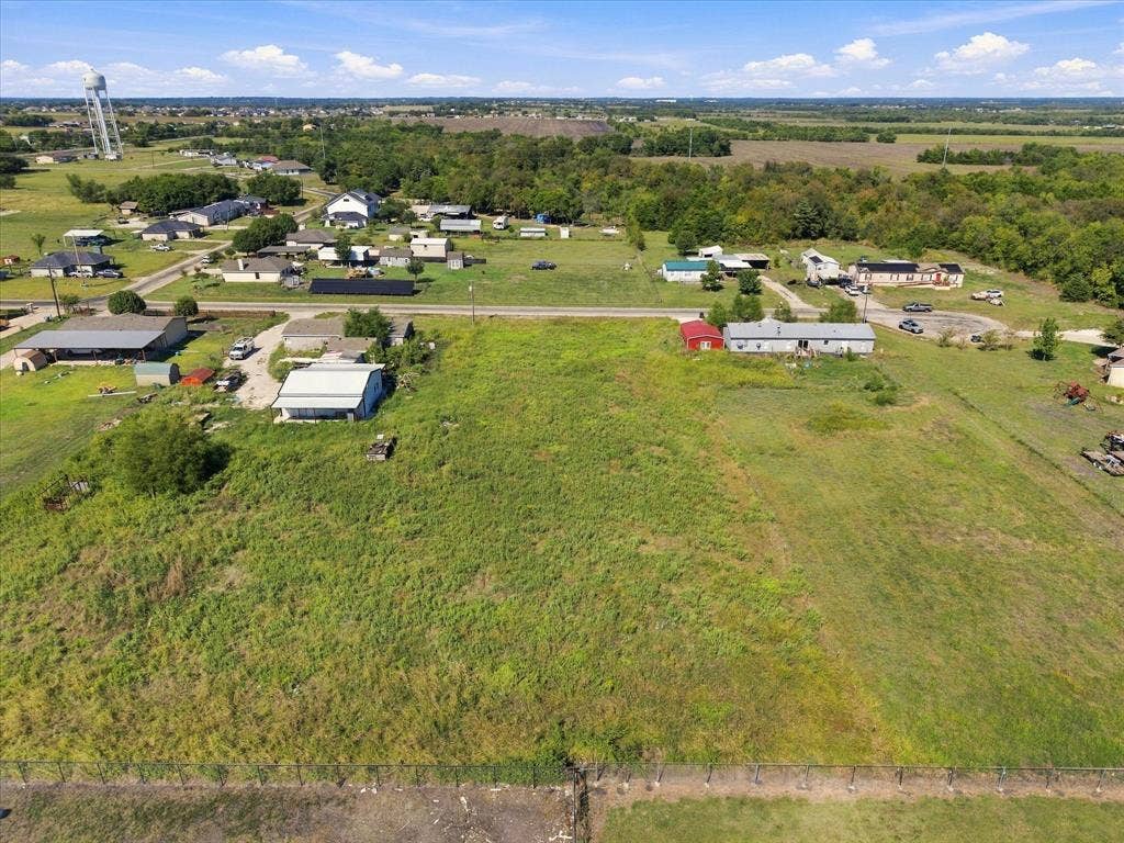 276 Winding River Circle, Farmersville, TX 75442 Expansive green space with distant residential structures and natural landscaping
