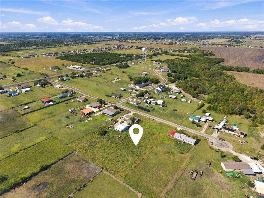 276 Winding River Circle, Farmersville, TX 75442 Expansive rural landscape featuring a mix of green fields and wooded areas