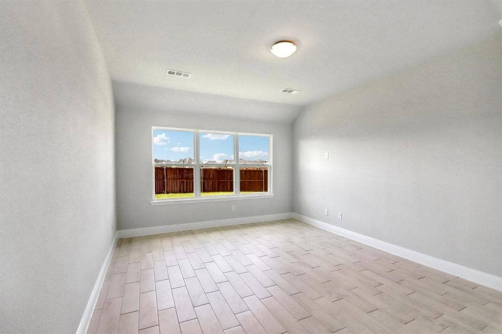 Recessed lighting, wood-finish flooring, and multiple windows