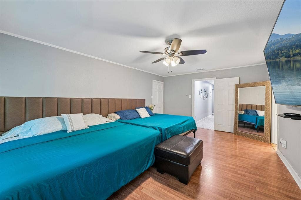 500 Spinner Road, DeSoto, TX 75115 Wood-finish flooring with light gray walls, white trim, and a ceiling fan