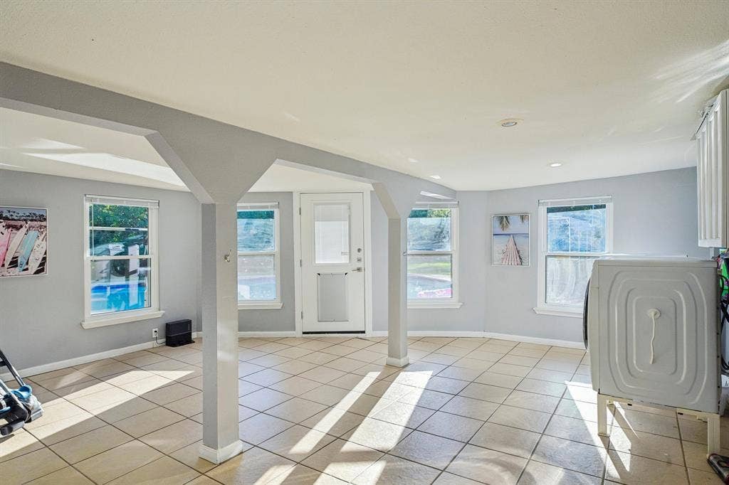 500 Spinner Road, DeSoto, TX 75115 Tile flooring, multiple windows, recessed lighting, and a glass-paneled exterior door