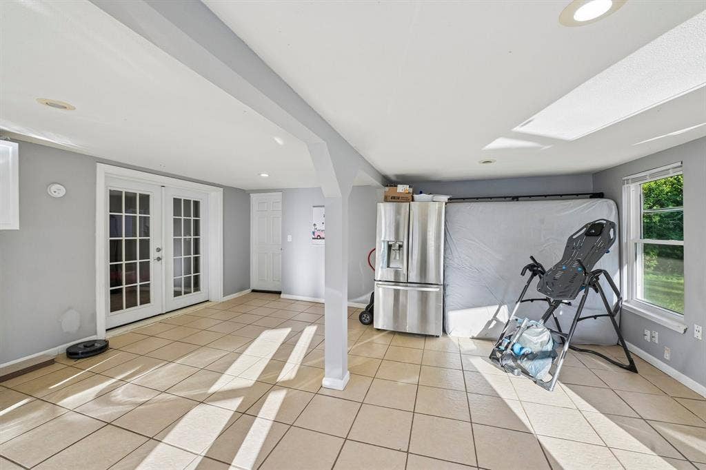 500 Spinner Road, DeSoto, TX 75115 Recessed lighting, tile flooring, and white French doors