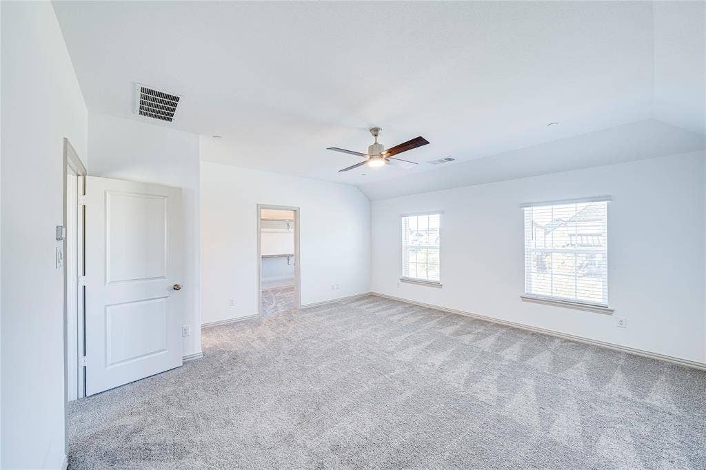 8888 Samara Street, Frisco, TX 75035 Spacious room featuring neutral carpeting, a ceiling fan, and two windows with blinds