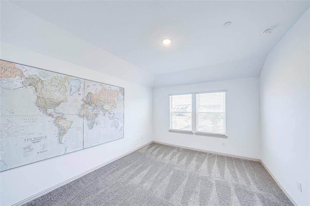 8888 Samara Street, Frisco, TX 75035 White interior walls, recessed lighting, and a window with blinds