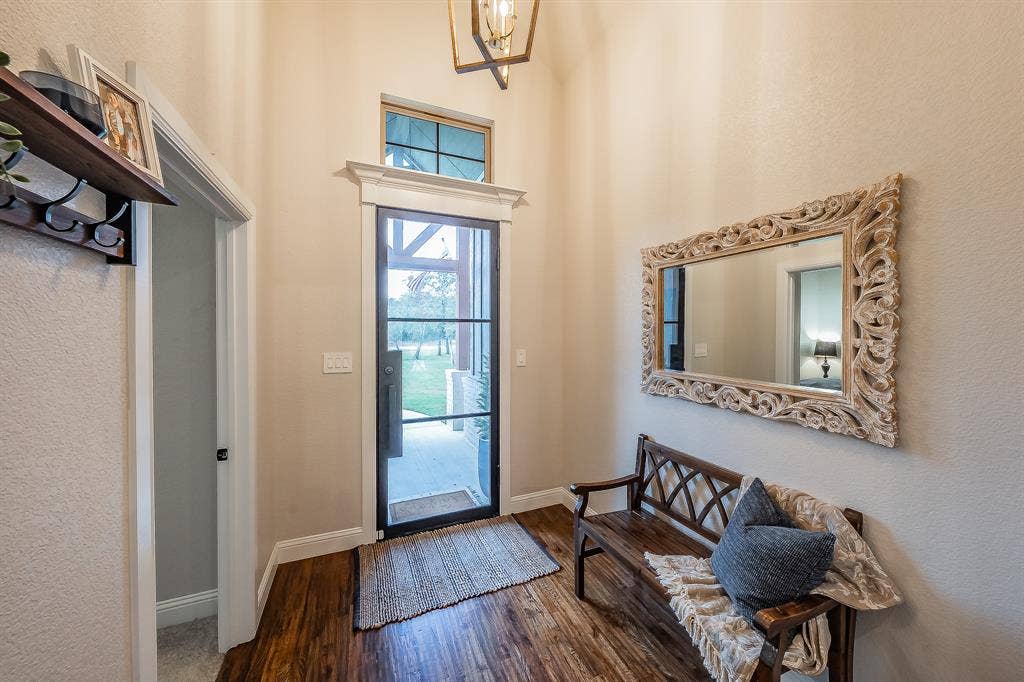 Love that iron front door! Door to left could be guest bedroom or home office