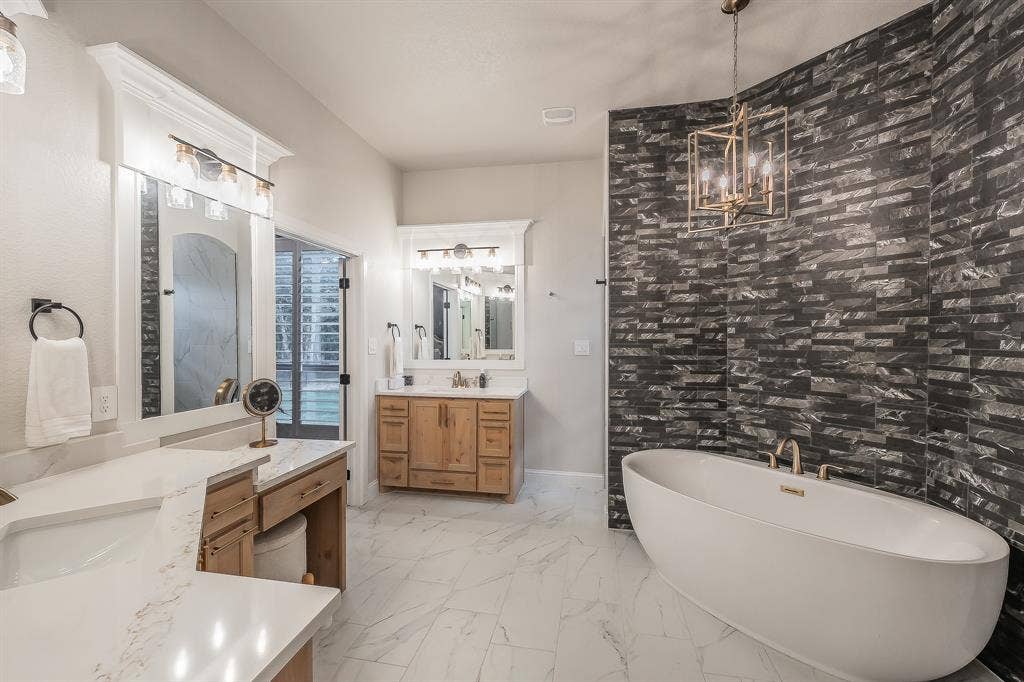 Separate vanities with custom framed and trimmed mirrors
