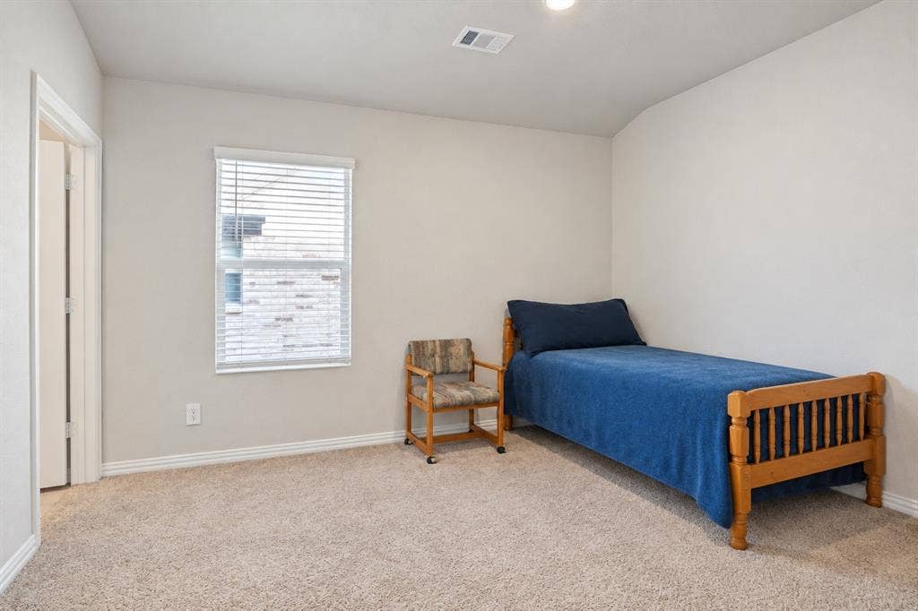 753 Poppy Lane, Lavon, TX 75166 Neutral-toned interior space featuring wall-to-wall carpeting and a single-hung window with horizontal blinds