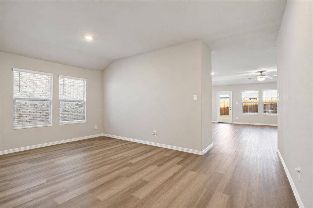 753 Poppy Lane, Lavon, TX 75166 Neutral-toned interior featuring wood-finish flooring, recessed lighting, and a ceiling fan