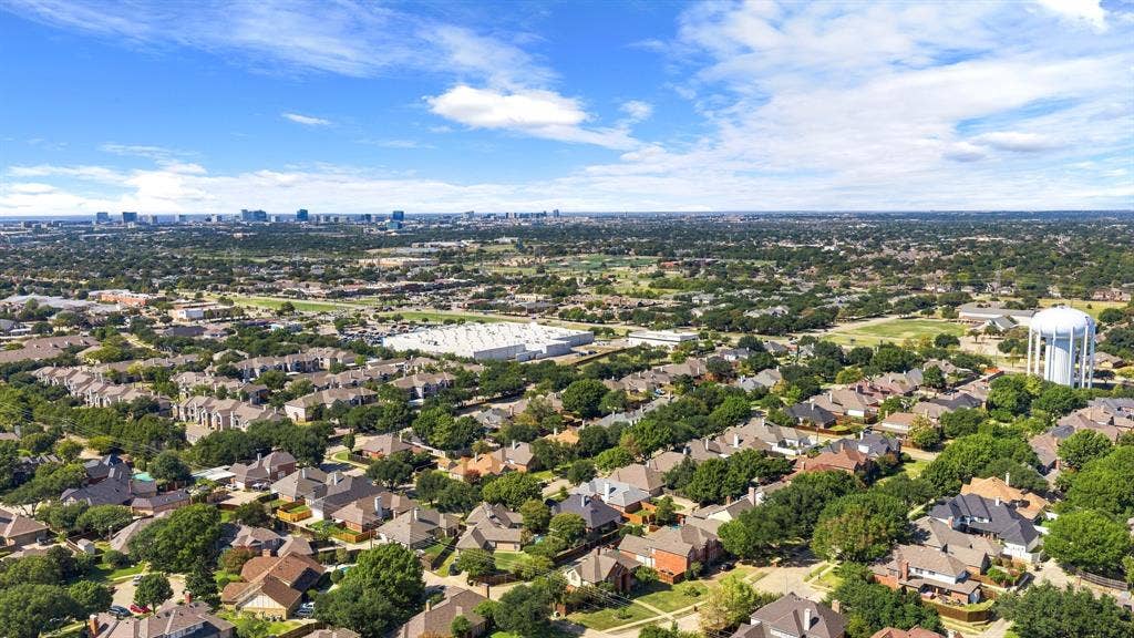 5104 Teddington Park Drive, Plano, TX 75023 Expansive residential neighborhood with abundant mature trees and a prominent water tower