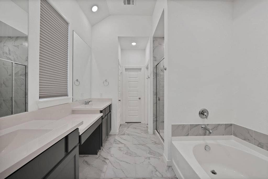 1553 Wyler Drive, Forney, TX 75126 Dual vanities with integrated sinks and light-colored countertops