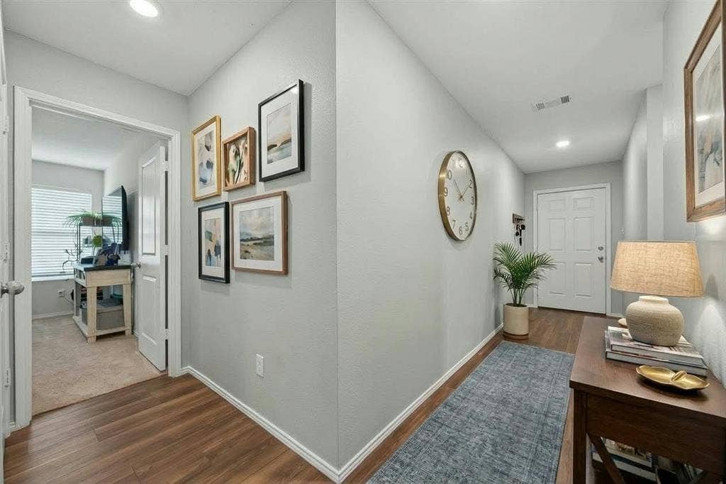 554 Deerfern Drive, Princeton, TX 75407 Wood-finish flooring throughout, recessed ceiling lighting, and a white paneled entry door