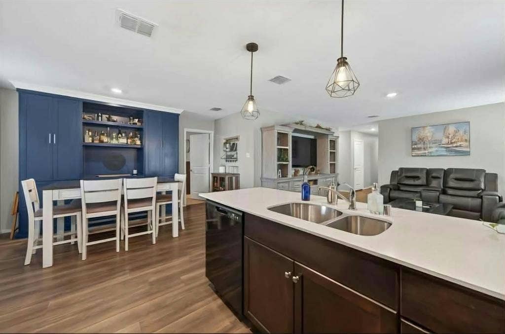 554 Deerfern Drive, Princeton, TX 75407 Spacious kitchen island with dual stainless steel sinks and light-colored countertops