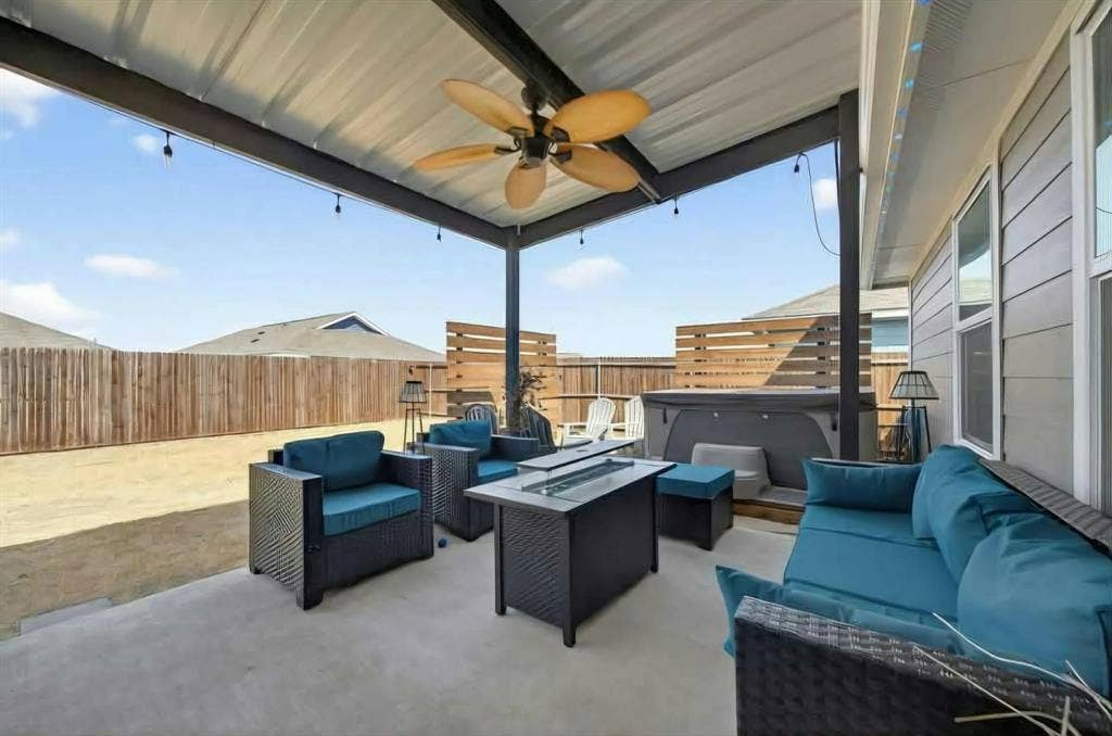 554 Deerfern Drive, Princeton, TX 75407 Covered patio featuring a ceiling fan, string lights, and a hot tub