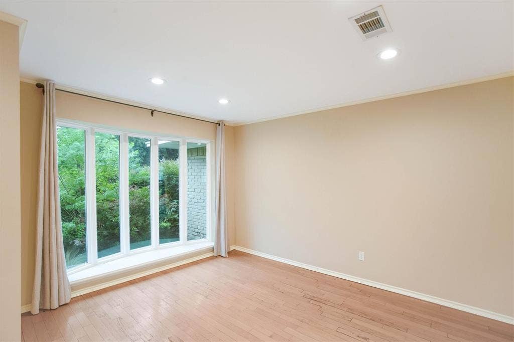 5 Ridgeview Circle, Richardson, TX 75080 Formal living room with tall windows is light and bright and makes a perfect flex space