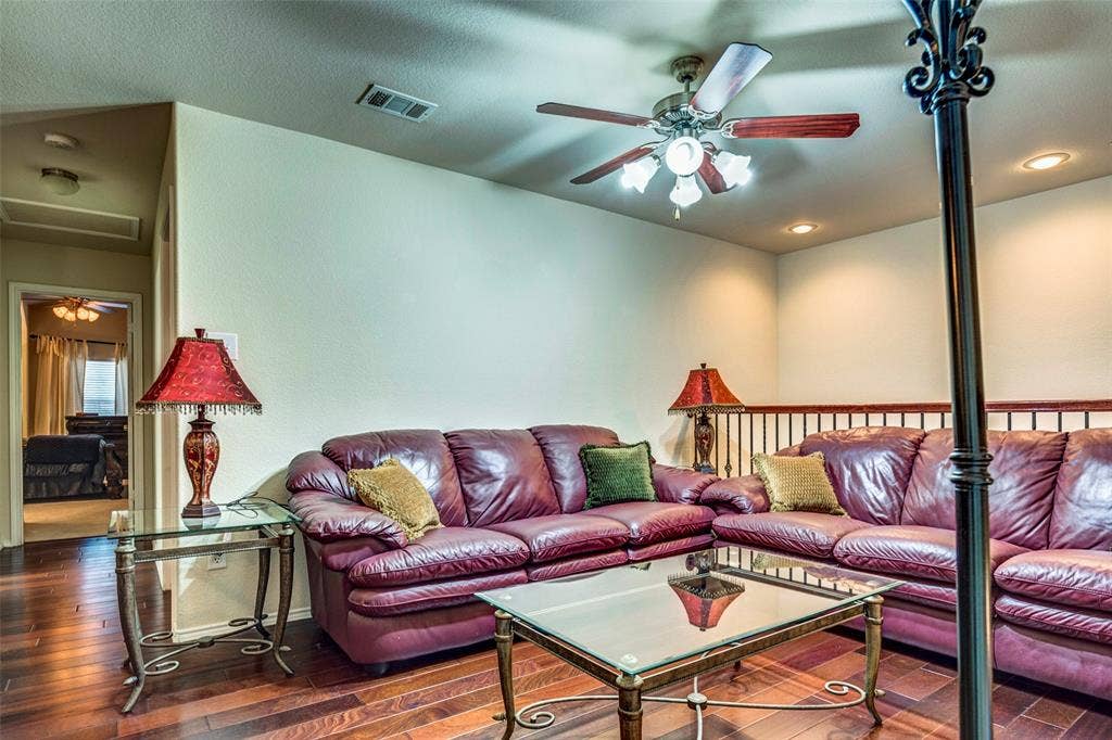 1040 Lucy Lane, Allen, TX 75013 Recessed lighting, wood-finish flooring, ceiling fan with light fixture, and a metal spindle railing