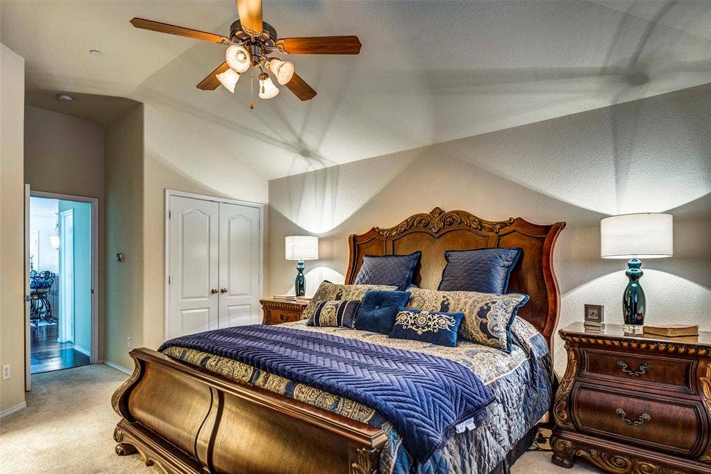 1040 Lucy Lane, Allen, TX 75013 Vaulted ceilings with a ceiling fan, carpet flooring, and double-door closet