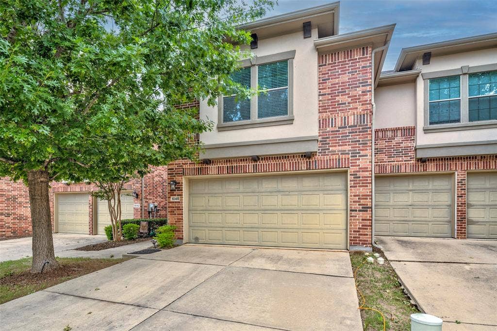 1040 Lucy Lane, Allen, TX 75013 Brick and stucco exterior with multiple windows