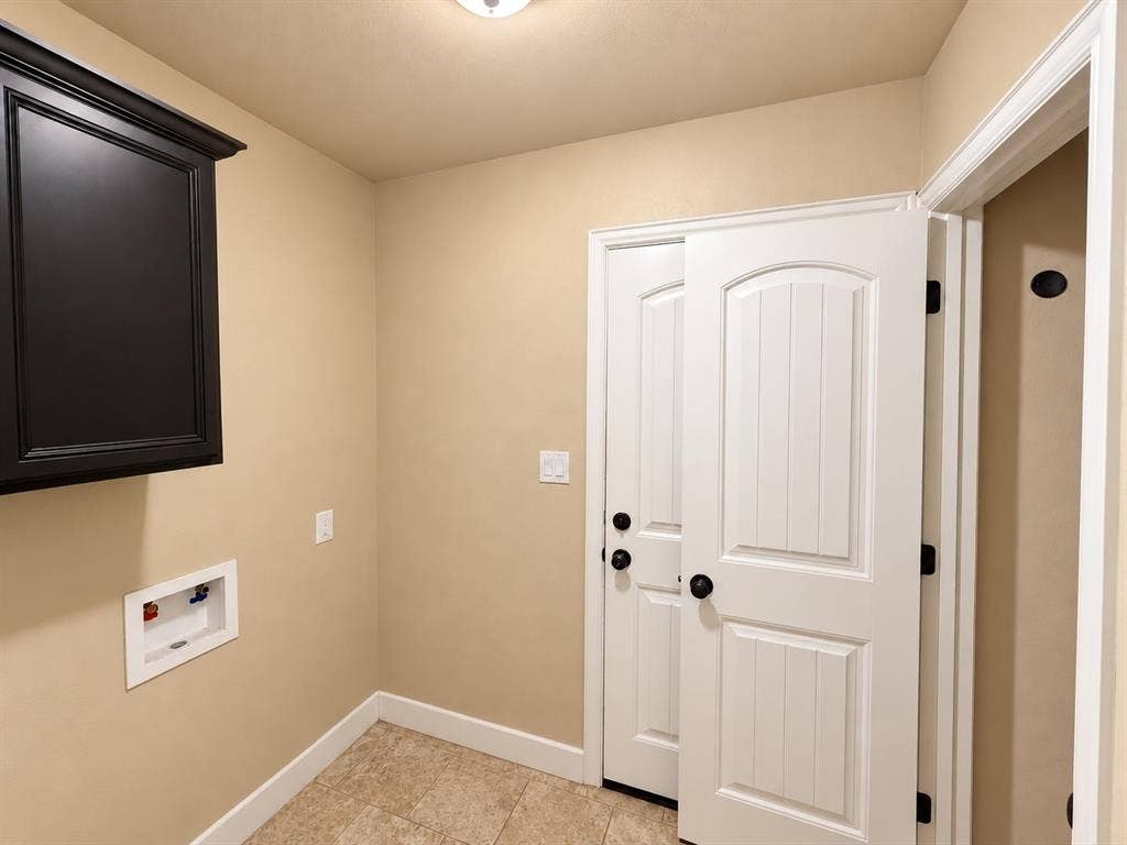 White paneled doors with matte black hardware