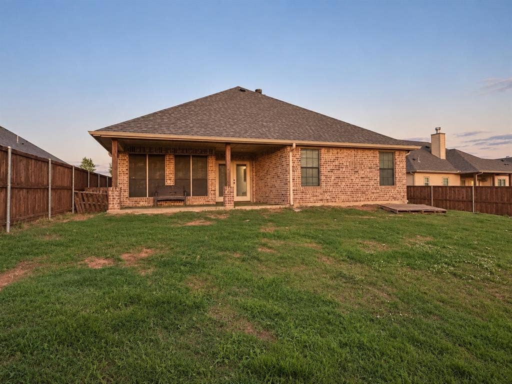 Brick exterior with a covered patio
