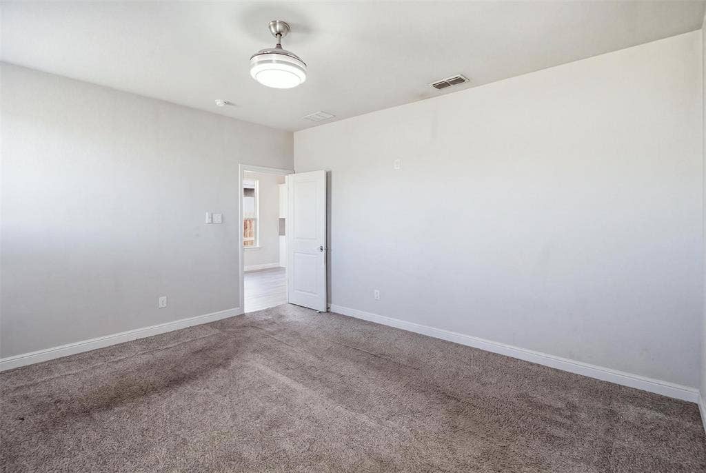 2513 Foules Drive, Glenn Heights, TX 75154 Carpeted flooring, neutral wall finish, ceiling-mounted light fixture, white door