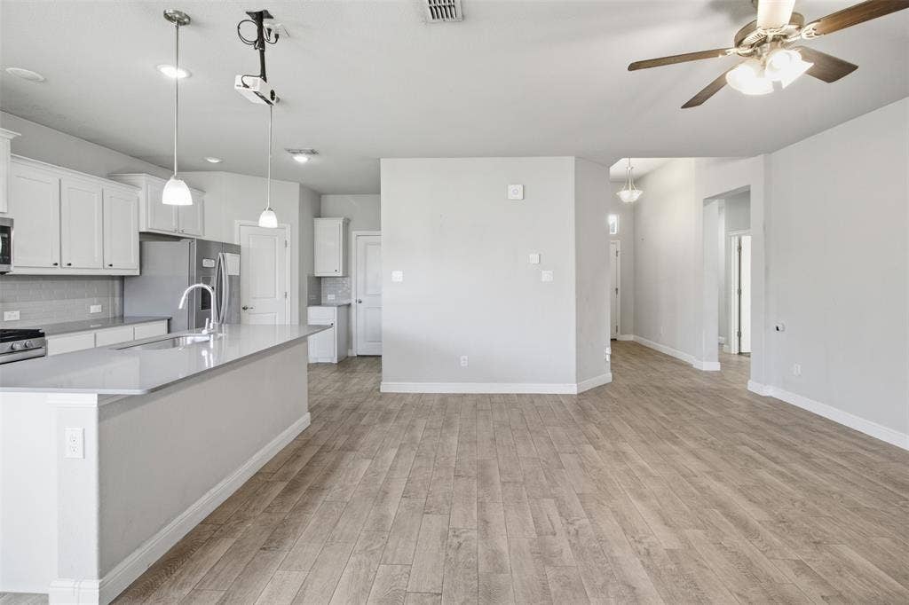 2513 Foules Drive, Glenn Heights, TX 75154 Spacious room featuring wood-finish flooring, recessed lighting, and a ceiling fan