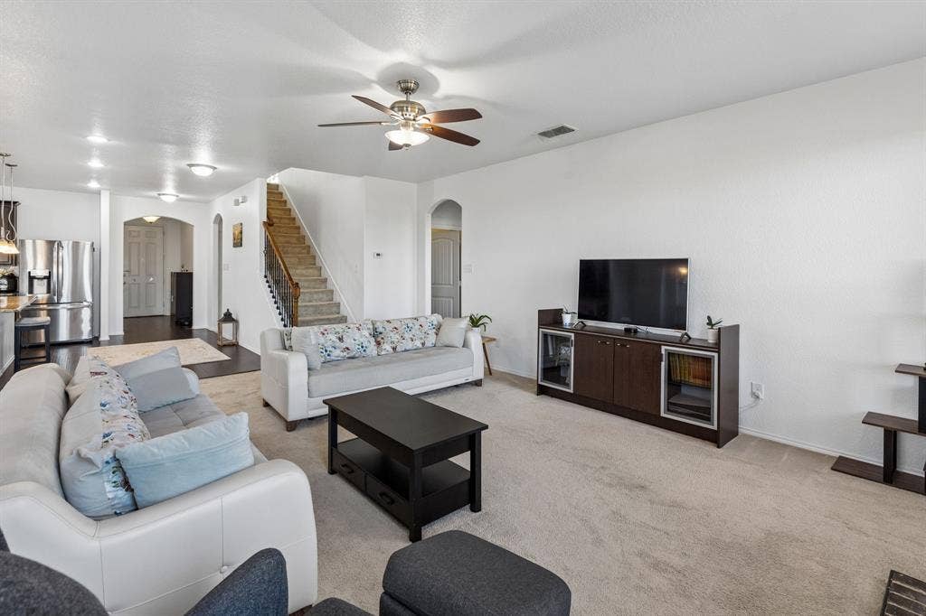 1501 Coyote Ridge Road, Wylie, TX 75098 Open concept living area with carpet flooring, recessed lighting, and a ceiling fan